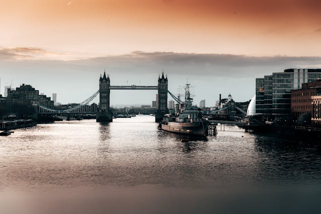 An early morning view from on the water of the River Thames, looking towards Tower Bridge in the distance. Image at LondonOfficeSpace.com.