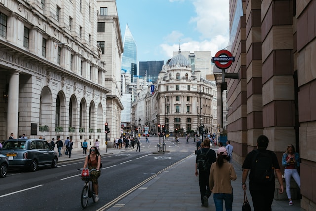 A view down a main street in London towards the historic Royal Exchange and the shiny high-rises of the financial district behind it. Image at LondonOfficeSpace.com.