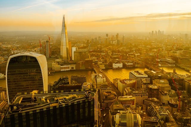 A golden hour view of the London skyline featuring The Shard and Walkie Talkie buildings, highlighting the prime office space locations for businesses using a brokerage in 2025. Image at LondonOfficeSpace.com.
